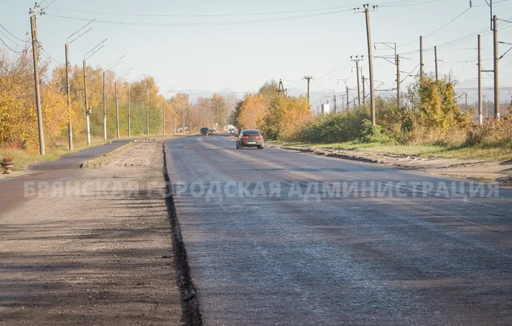 Дорога с частично новым асфальтом
